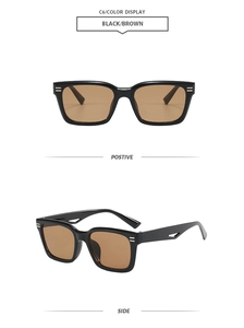 Detail view of square black frame sunglasses with brown lenses and geometric hollow temples
