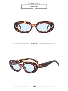 Detail of retro oval tortoiseshell sunglasses with blue lenses and silver stud rivets