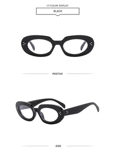 Macro view of retro oval black sunglasses featuring silver triple-dot rivet details