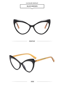 Detail view of stylish black cat-eye glasses frames with amber brown temples