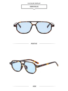 Detail of tortoise frame aviator sunglasses with blue lenses and metal rivet accents