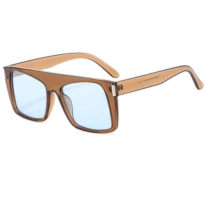 Chic oversized square sunglasses with translucent brown frames and blue tinted lenses
