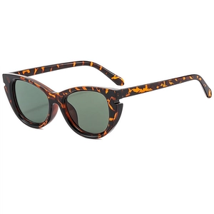 Retro cat-eye tortoiseshell sunglasses with dark green lenses for outdoor travel