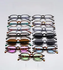 Matrix display of 13 colorful cat-eye sunglasses featuring vintage frames and diverse lenses