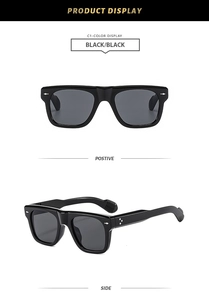 Detail view of black rectangular retro sunglasses with silver arrow rivets and metal pins