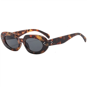 Retro oval tortoiseshell sunglasses with dark grey lenses and silver rivet accents