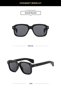 Close-up of classic thick black square frame sunglasses with silver rivet details