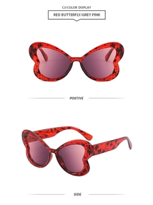 Vues détaillées de lunettes papillon rouges avec verres gris rose et monture écaillée