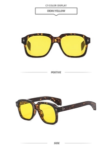 Detail view of stylish tortoiseshell square frames with yellow translucent lenses