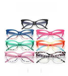 Flat lay view of cat-eye eyeglass frames in seven diverse gradient colors and patterns