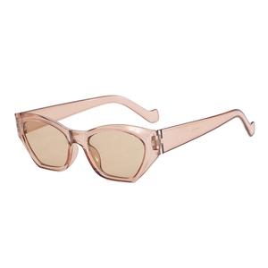 Vintage cat-eye sunglasses with transparent pink resin frame and amber tinted lenses