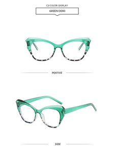 Detail view of green demi cat-eye glasses frame with emerald top and tortoiseshell bottom