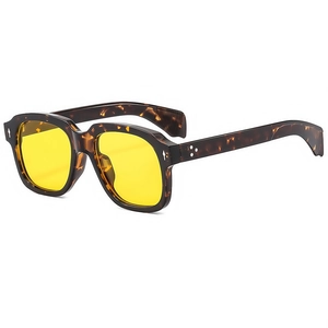 Classic tortoise shell square sunglasses with yellow lenses and metal rivet accents