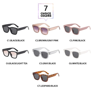 Flat lay of seven stylish square sunglasses in various colors with metal hinge detail