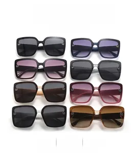 Flat lay of retro square oversized sunglasses in 8 assorted colors and gradient lenses
