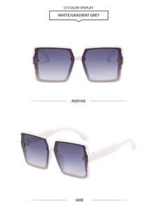 Detail view of white square frame sunglasses with gradient grey lenses and G accents