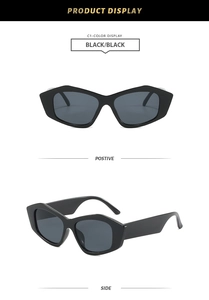 Macro view of black chunky irregular cat-eye sunglasses with UV400 grey lenses