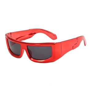 Futuristic red wide-frame sunglasses with grey lenses in a Y2K cyberpunk style