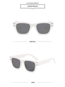 Detail view of retro square white sunglasses with dark lenses and silver side accents