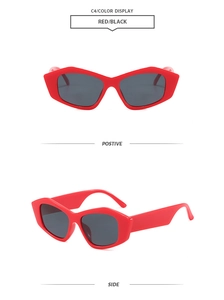 Detail view of red cat eye sunglasses with dark lenses from front and side perspectives