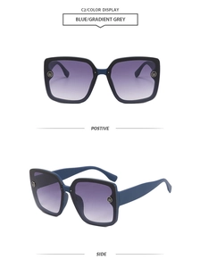 Detail view of square blue sunglasses with purple gradient lenses and side logo