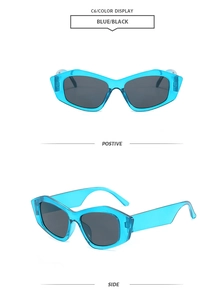 Detail view of transparent blue cat-eye sunglasses with dark lenses and geometric frame