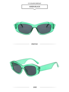Detail view of green geometric cat-eye sunglasses with dark lenses from front and side