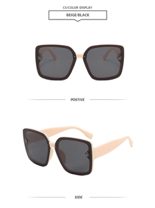Detail view of beige square sunglasses with dark grey lenses and metal W logo