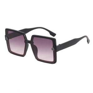 Fashionable oversized square sunglasses with black frame and purple gradient lenses