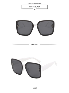 Front and side view of oversized square sunglasses with white frames and black temples
