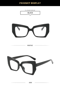 Detail view of black chunky cat-eye glasses frames with bold geometric design