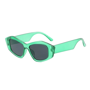 Modern oversized geometric cat-eye sunglasses with translucent green frame and dark lenses