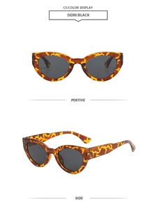 Detail view of vintage cat-eye sunglasses in demi leopard print with dark grey lenses