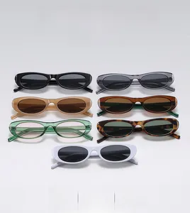 Collection of retro small-frame sunglasses in various colors on flat lay background