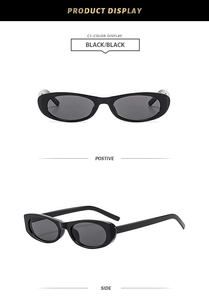 Close-up detail of black polygonal sunglasses showing front and side profile views
