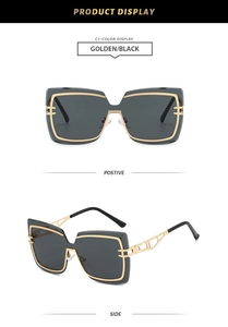 Close-up of golden hollow geometric temples and rimless grey lenses on sun glasses