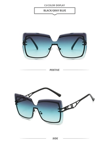 Detail view of oversized rimless square sunglasses with grey blue gradient lenses