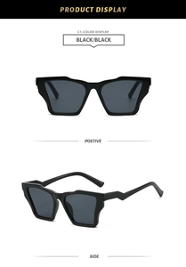 Détail de lunettes de soleil polygonales avec des branches en forme d'éclair