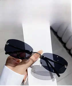 Detail of rimless polygon sunglasses with nickel metal bridge and black acetate temples