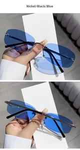 Detail view of rimless polygon sunglasses with nickel bridge and blue tinted lenses