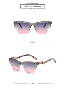 Détail de lunettes de soleil polygonales oversize avec verres dégradés gris et rose