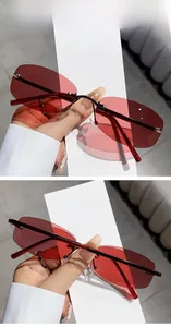 Detail of purple to wine red gradient lenses on these rimless rectangle fashion sunglasses