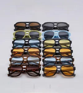 Collection of retro double-bridge pilot sunglasses in various vibrant frame colors
