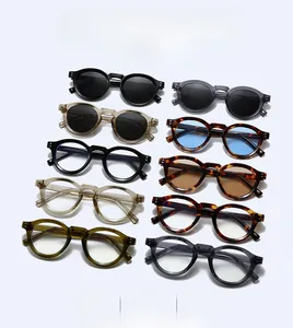 Detailed close-up showing a colorful array of round frame sunglasses and optical glasses