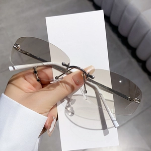 Frameless polygonal sunglasses with silver metal frame and gradient dark grey lenses
