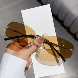 Fashionable rimless polygon sunglasses with amber gradient lenses and gold metal bridge