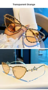 Détails de lunettes œil de chat avec strass et verres orange transparents élégants