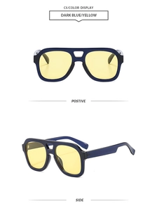 Detail view of aviator sunglasses featuring a dark blue frame and yellow lenses
