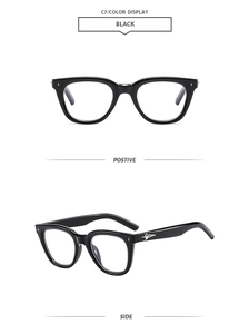 Detailed views of black thick frame sunglasses with silver star metal decorations