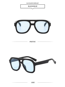 Detail view of double bridge aviator sunglasses with black frame and blue tinted lenses